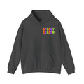 A dark gray pullover hoodie with a colorful graphic on the chest that reads 'SPOOKY SEASON' in a rainbow gradient font, displayed against a solid white background.