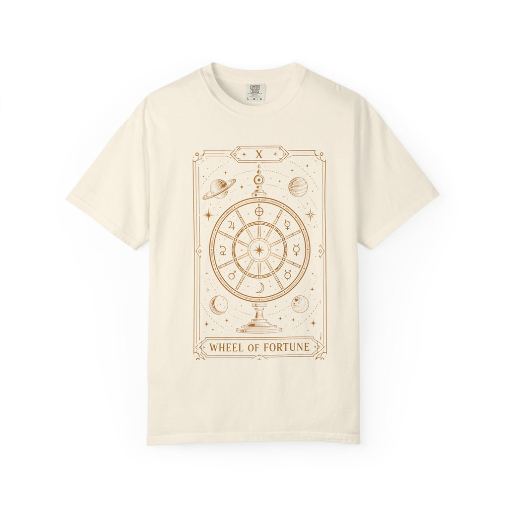 An off-white short-sleeve t-shirt with a tan 'Wheel of Fortune' tarot card graphic printed on the front, displayed against a solid white background.