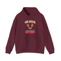 A maroon hoodie with a graphic on the chest. The graphic features the text 'OH DEER' in a beige arched font above a cartoon reindeer face with gold antlers and a red nose, followed by the text 'ANOTHER HOLIDAY SIDE QUEST' in green and red.