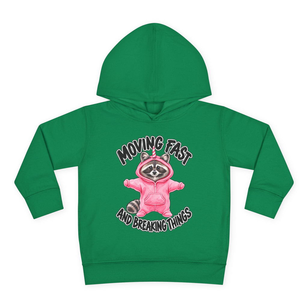 green childrens  hoodie with black text that reads MOVING FAST AND BREAKING THINGS around a racoon dressed in a pink onesie with a unicorn horn against a white background
