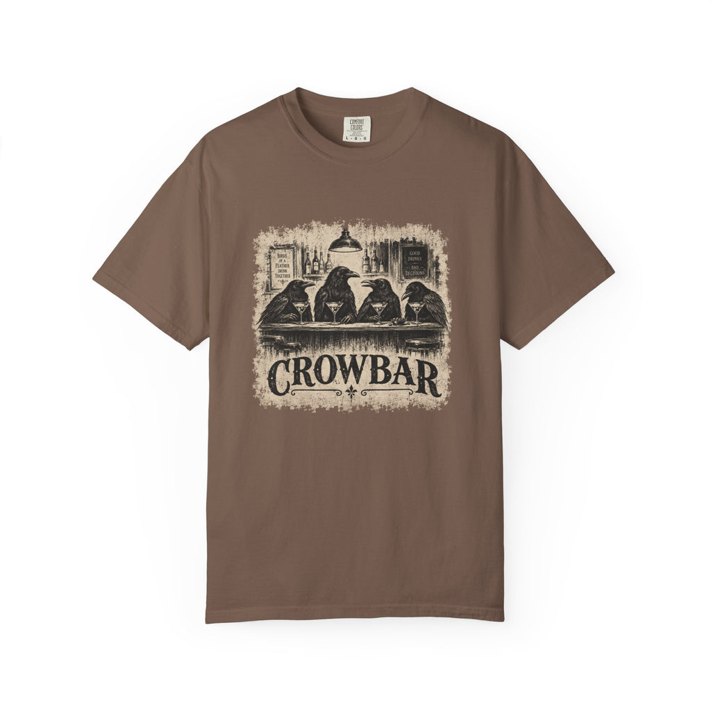 A brown short-sleeve crewneck t-shirt featuring a distressed black and beige graphic print of four crows sitting at a bar with the word 'CROWBAR' underneath, displayed on a clean white background.