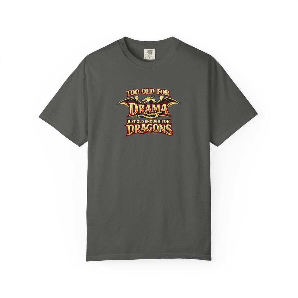 An grey short-sleeve crewneck t-shirt featuring a graphic print on the chest that reads 'TOO OLD FOR DRAMA BUT OLD ENOUGH FOR DRAGONS' in a stylized gold and black dragon-themed font.