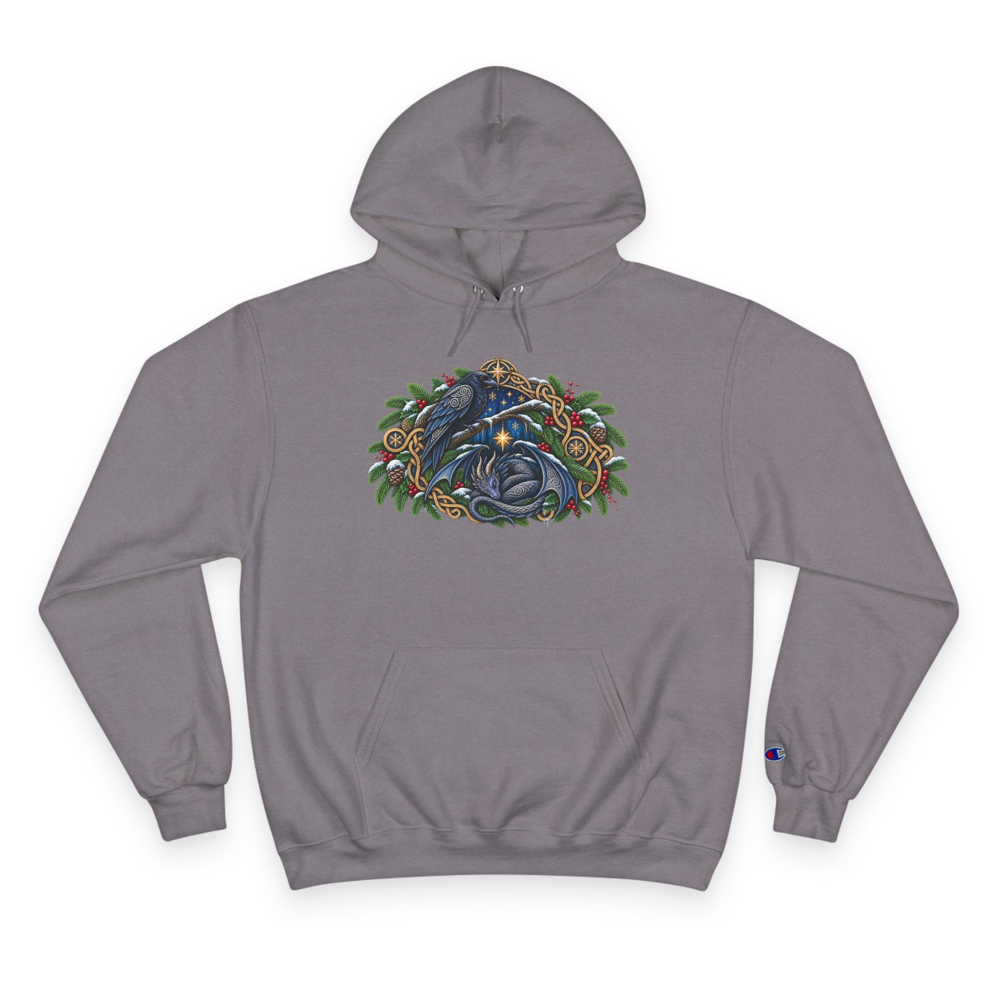 A gray pullover hoodie featuring a detailed graphic of a blue raven and a dragon surrounded by green pine boughs  A small blue Champion 'C' logo is visible on the left sleeve cuff. against a white background