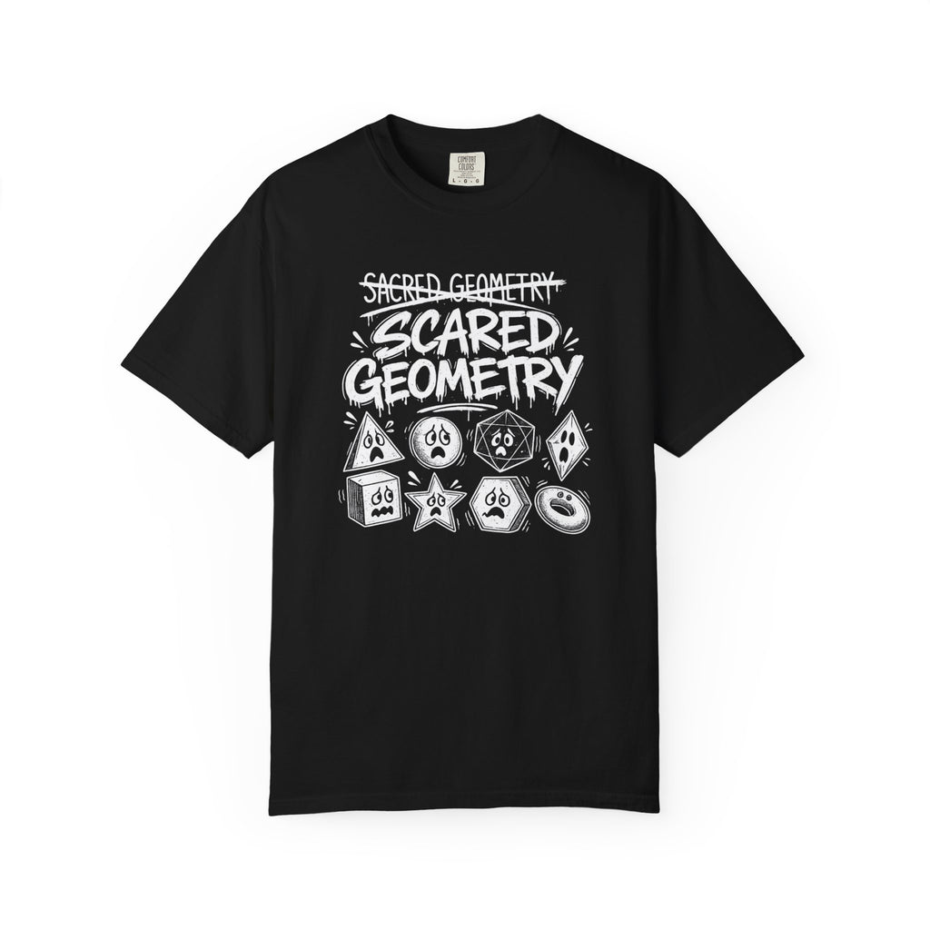 A black short-sleeve crewneck t-shirt featuring a white hand-drawn graphic that reads 'Sacred Geometry' crossed out above 'Scared Geometry' in bold lettering, with spooky-faced dice and geometric shapes below, shown on a plain white background.