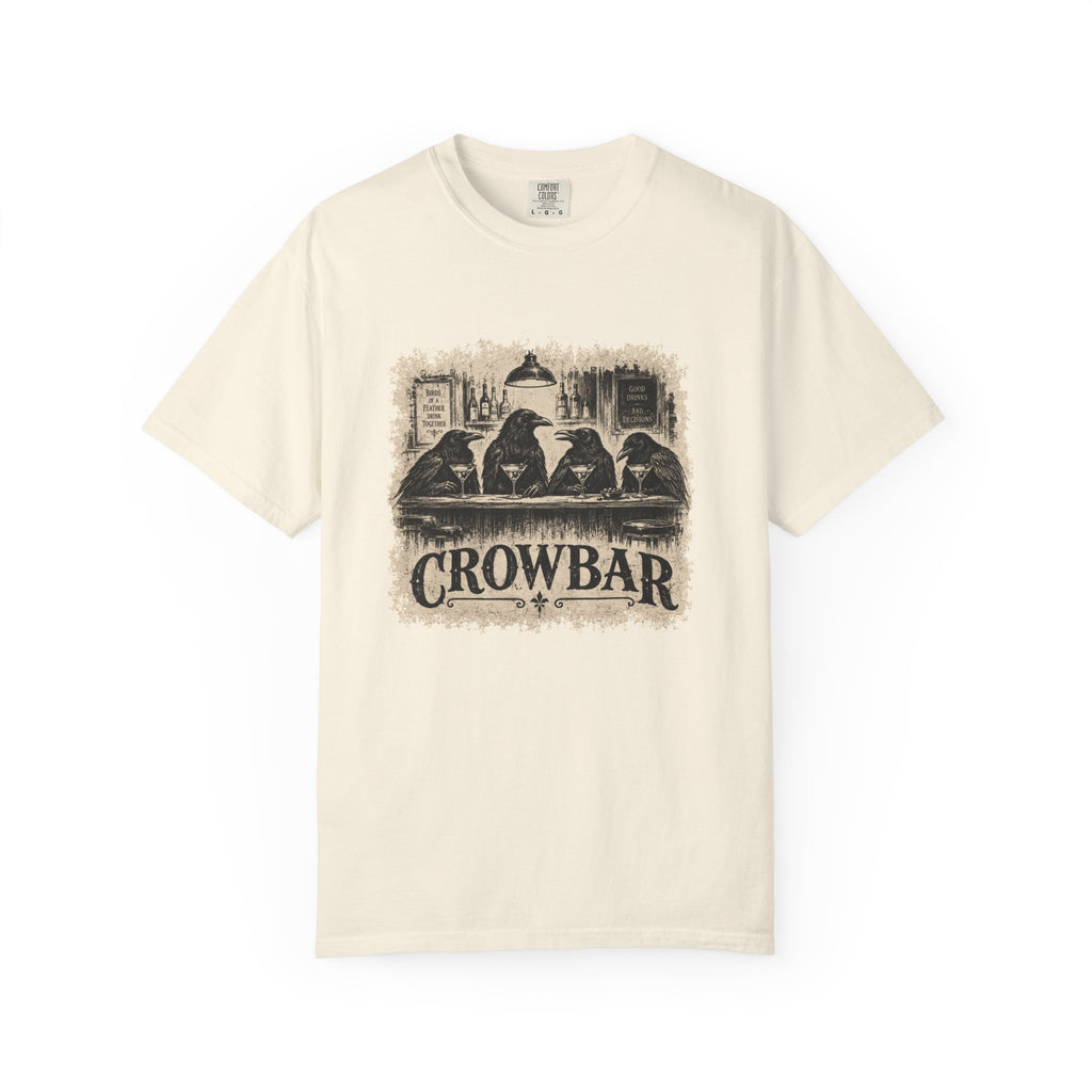An off-white short-sleeve crewneck t-shirt featuring a vintage-style sepia graphic of four crows sitting at a bar with the word 'CROWBAR' printed below, displayed on a clean white background.