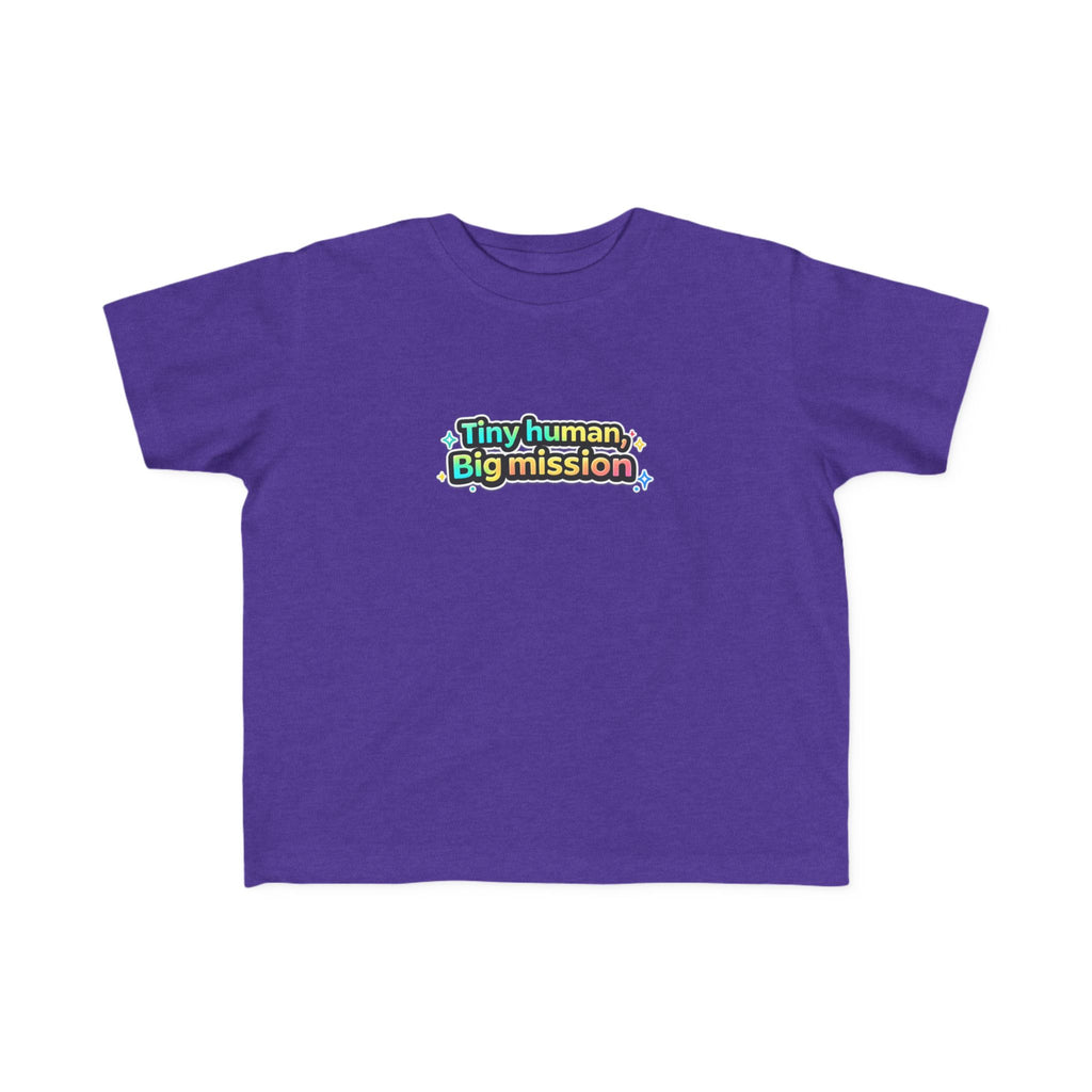Purple t-shirt with colorful text 'Tiny human, Big mission' on a white background