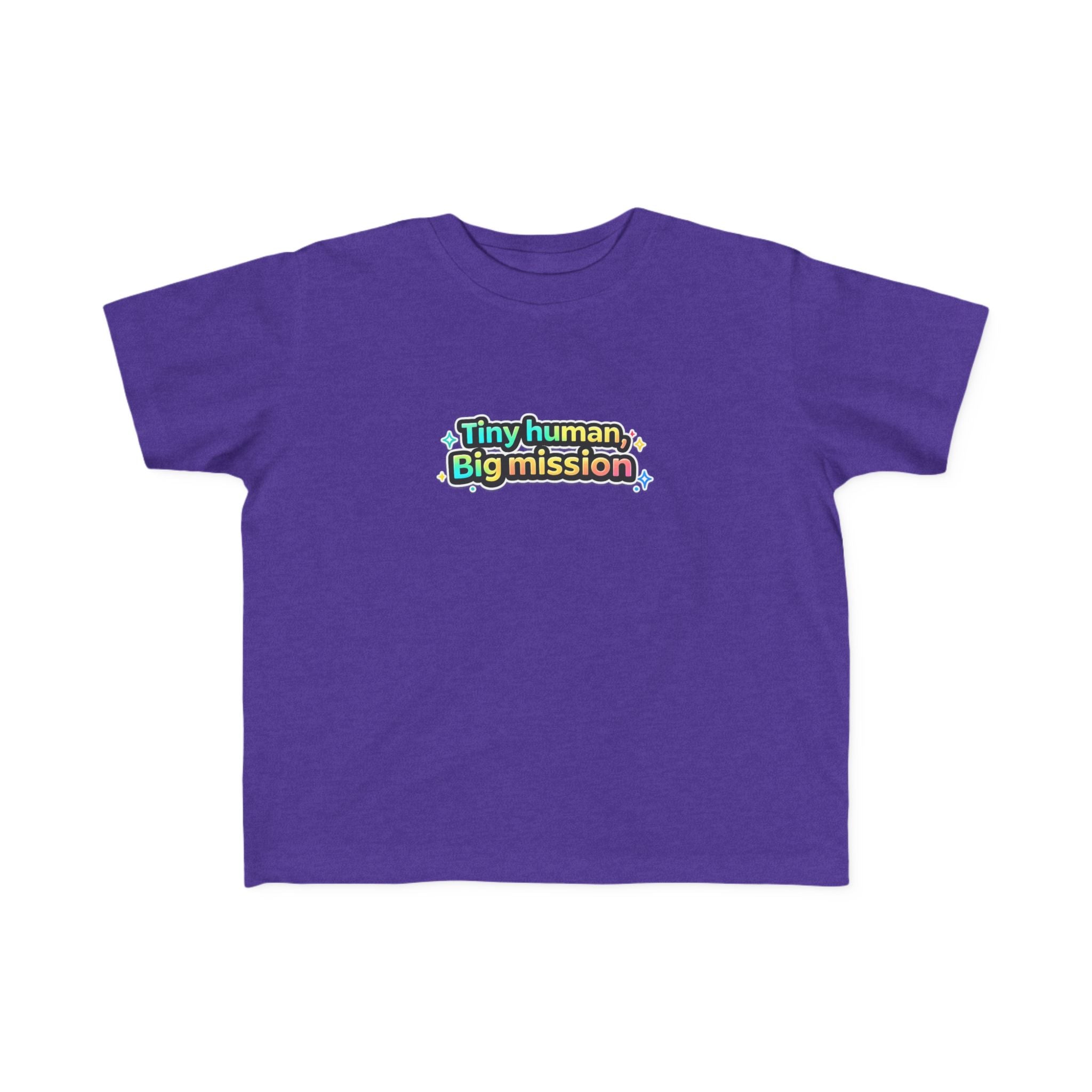 Purple t-shirt with colorful text 'Tiny human, Big mission' on a white background