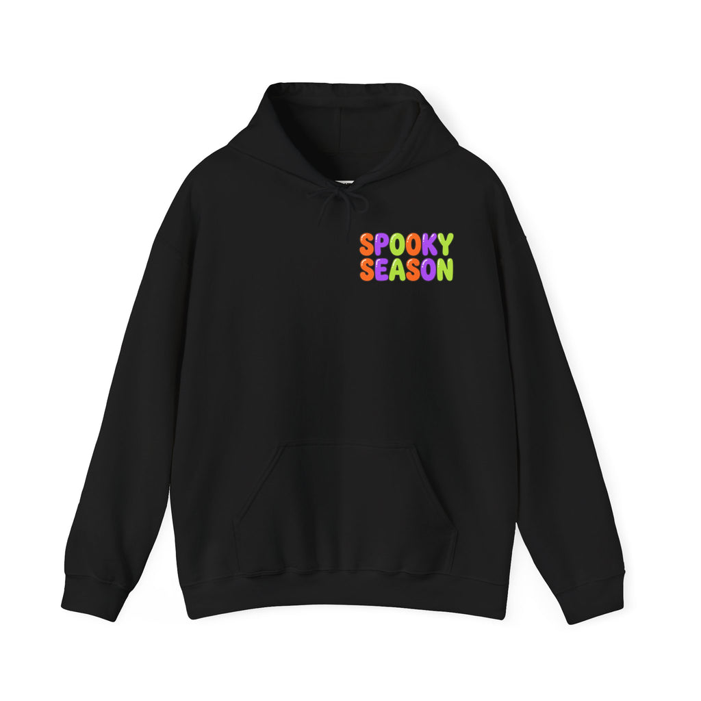 A black pullover hoodie with a colorful graphic on the chest that reads 'SPOOKY SEASON' in a rainbow gradient font, displayed against a solid white background.
