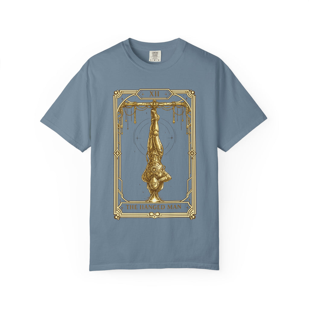 a blue crewneck t-shirt featuring The Hanged Man from the Future Arcana collection, inspired by The Hanged Man tarot card. A futuristic explorer hangs suspended upside down within an elegant Art Deco celestial frame, illustrated in vintage gold line art on a transparent background.