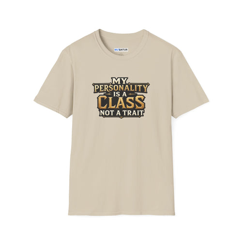 A beige crewneck t-shirt with a graphic text print that reads 'MY PERSONALITY IS A CLASS NOT A TRAIT' in black and gold lettering, displayed on a clean white background.