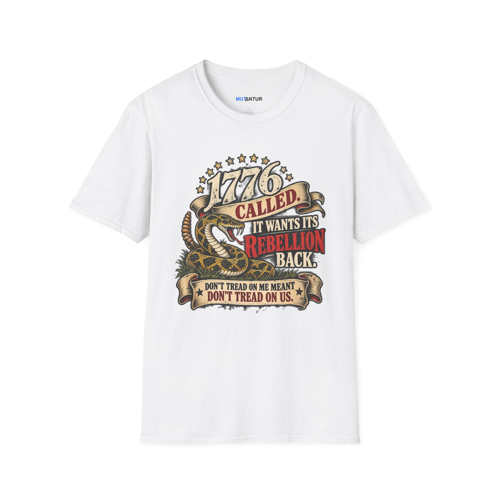 A white short-sleeve crewneck t-shirt featuring a detailed graphic print on the front. The graphic depicts a coiled rattlesnake with the text '777 CALLED IT WANTS ITS REBELLION BACK DONT TREAD ON ME MEANS DONT TREAD ON US  against a white background