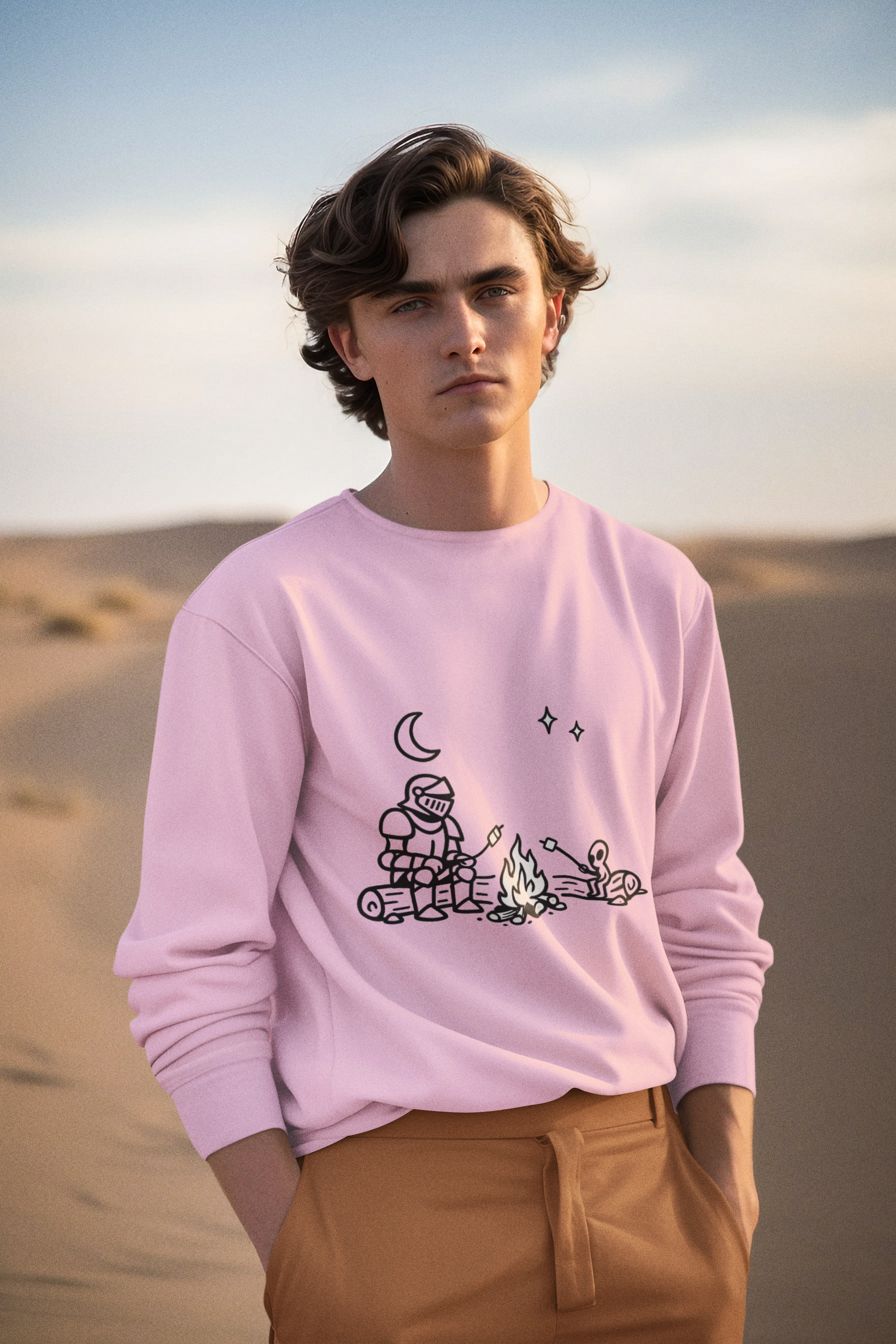 Man wearing a pink Camping Knight and Alien Crewneck Sweatshirt - Mutantur Labs LLC at the beach