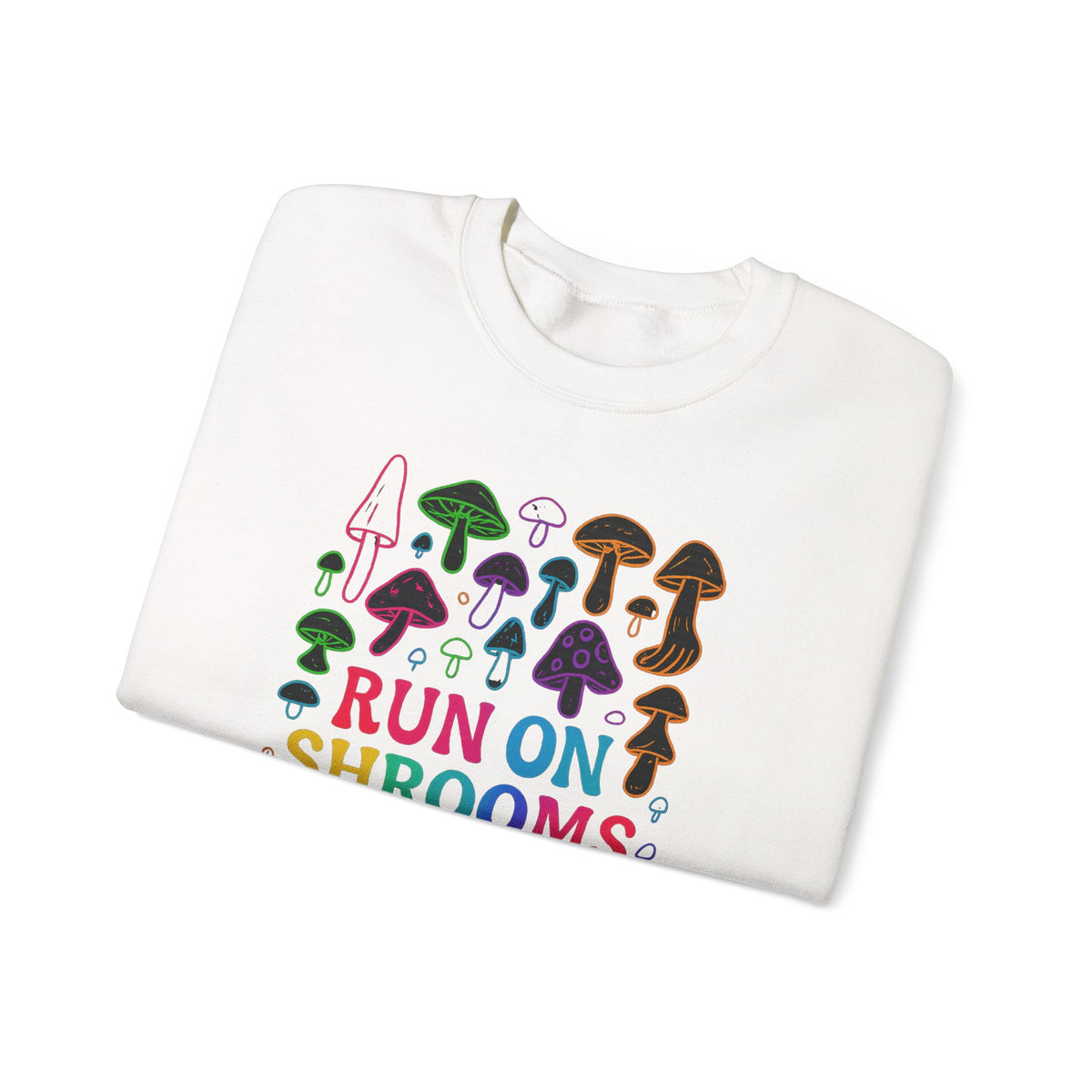 A folded white crewneck sweatshirt featuring a colorful graphic of various illustrated mushrooms and the text 'RUN ON SHROOMS' in a playful multicolor font, set against a plain white background.
