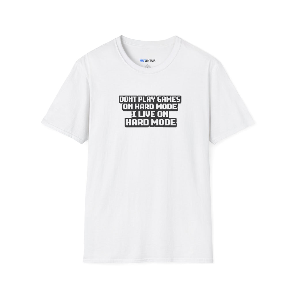 A white short-sleeve crewneck t-shirt with a black graphic text print on the chest that reads 'DONT PLAY GAMES ON HARD MODE I LIVE ON HARD MODE'.