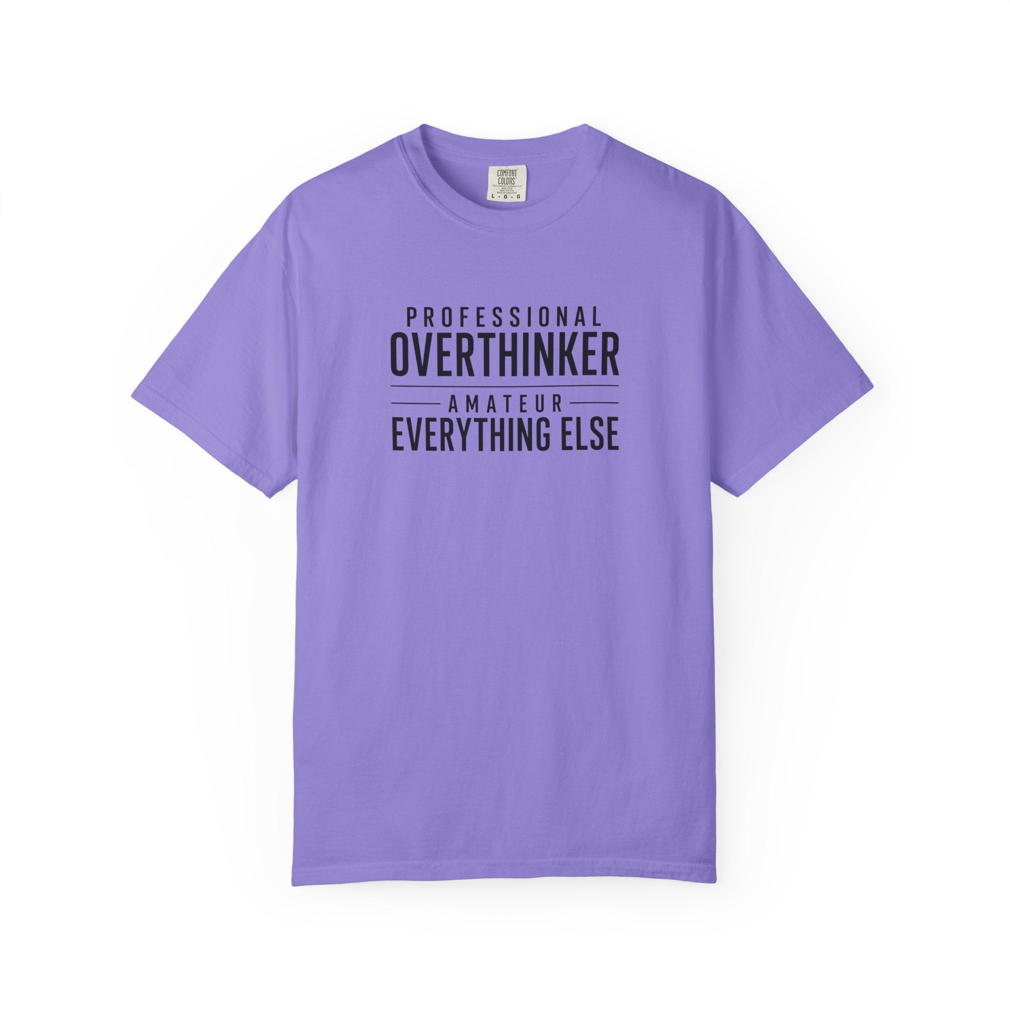 A periwinkle short-sleeve t-shirt with black text on the chest reading 'PROFESSIONAL OVERTHINKER AMATEUR EVERYTHING ELSE', displayed against a plain white background.