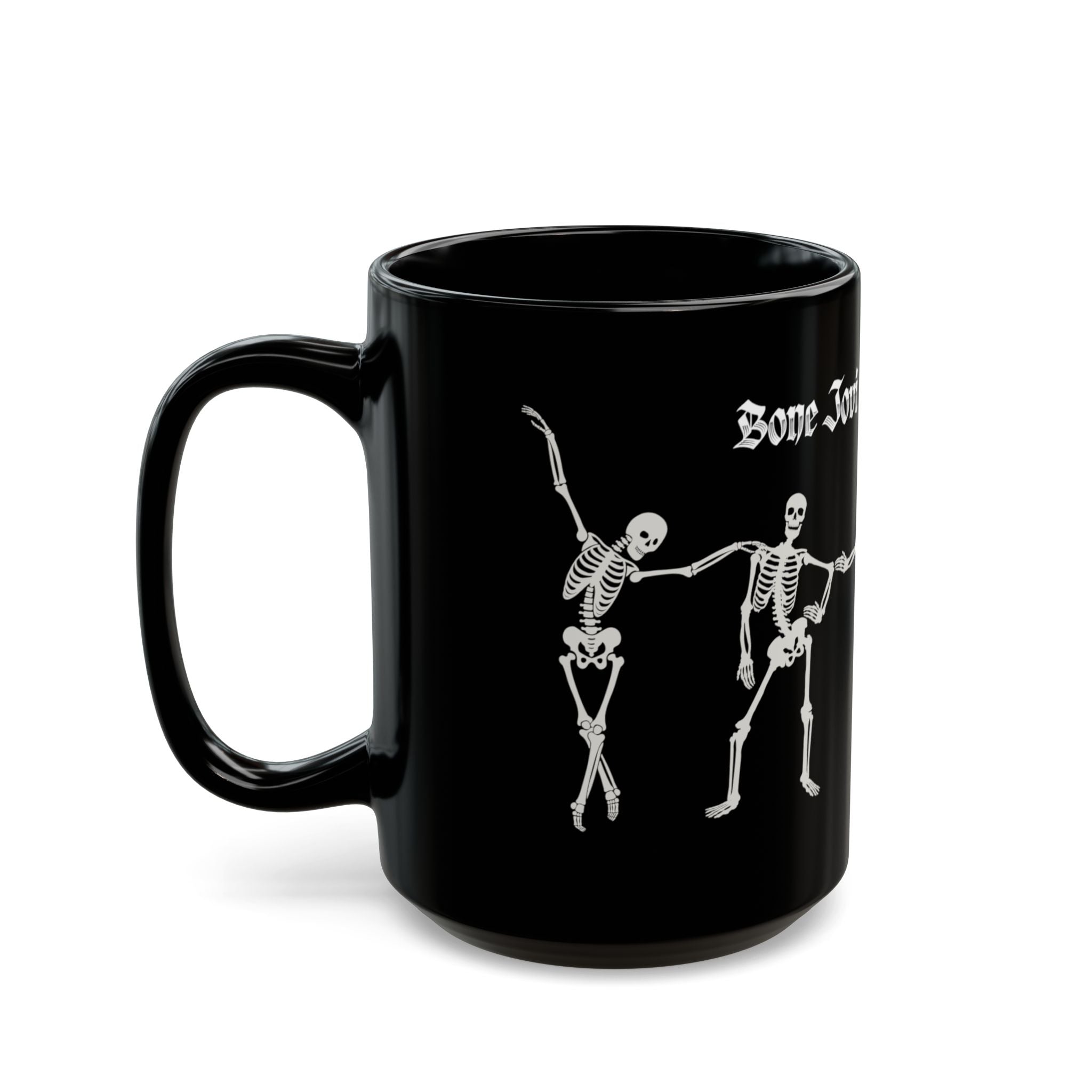 A black ceramic mug with white gothic-style text reading 'Bone Jovi' and a white skeleton dancing skeletons against a white background