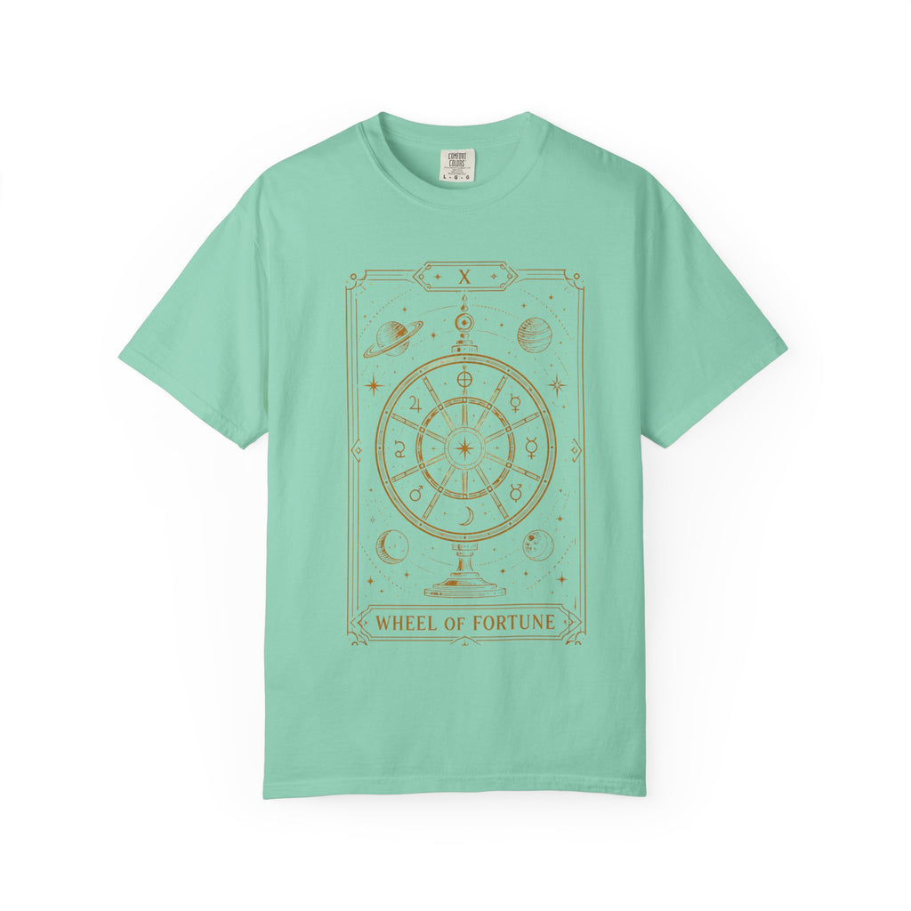 A mint green Comfort Colors t-shirt featuring Wheel of Fortune from the Future Arcana collection, inspired by the Wheel of Fortune tarot card. A celestial cosmic wheel surrounded by stars and planets is illustrated in elegant retro sci-fi gold line art within an Art Deco tarot frame on a transparent background