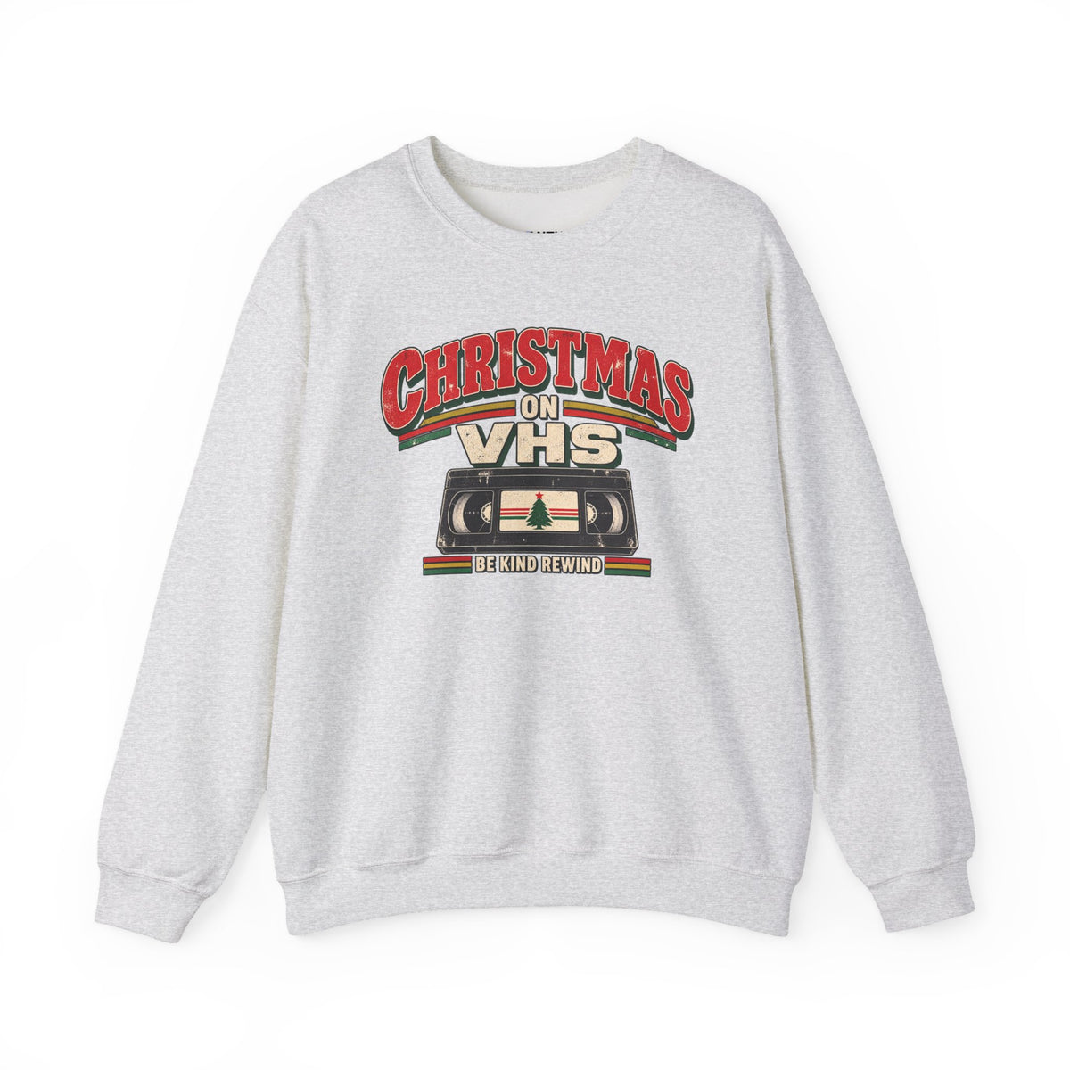 A gray crewneck sweatshirt featuring a retro VHS graphic with the text 'CHRISTMAS ON VHS' and 'BE KIND REWIND' on a white background.