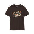 A dark brown short-sleeve t-shirt with a retro-style graphic on the chest featuring a VHS tape and the text 'BE KIND REWIND'. The shirt is displayed flat against a solid white background.