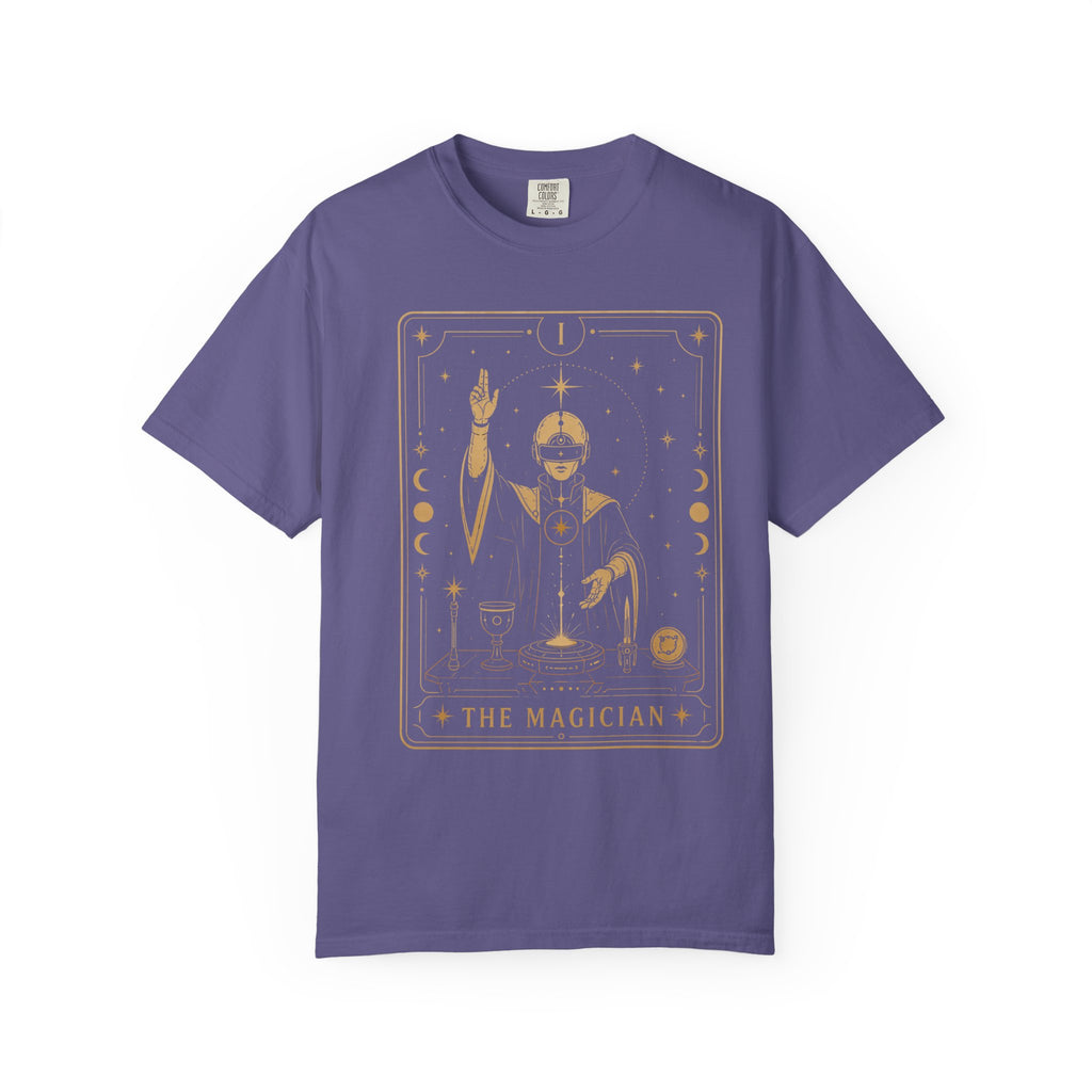 A purple short-sleeve crewneck t-shirt featuring a gold-colored graphic of 'The Magician' tarot card on the front, displayed against a solid white background.