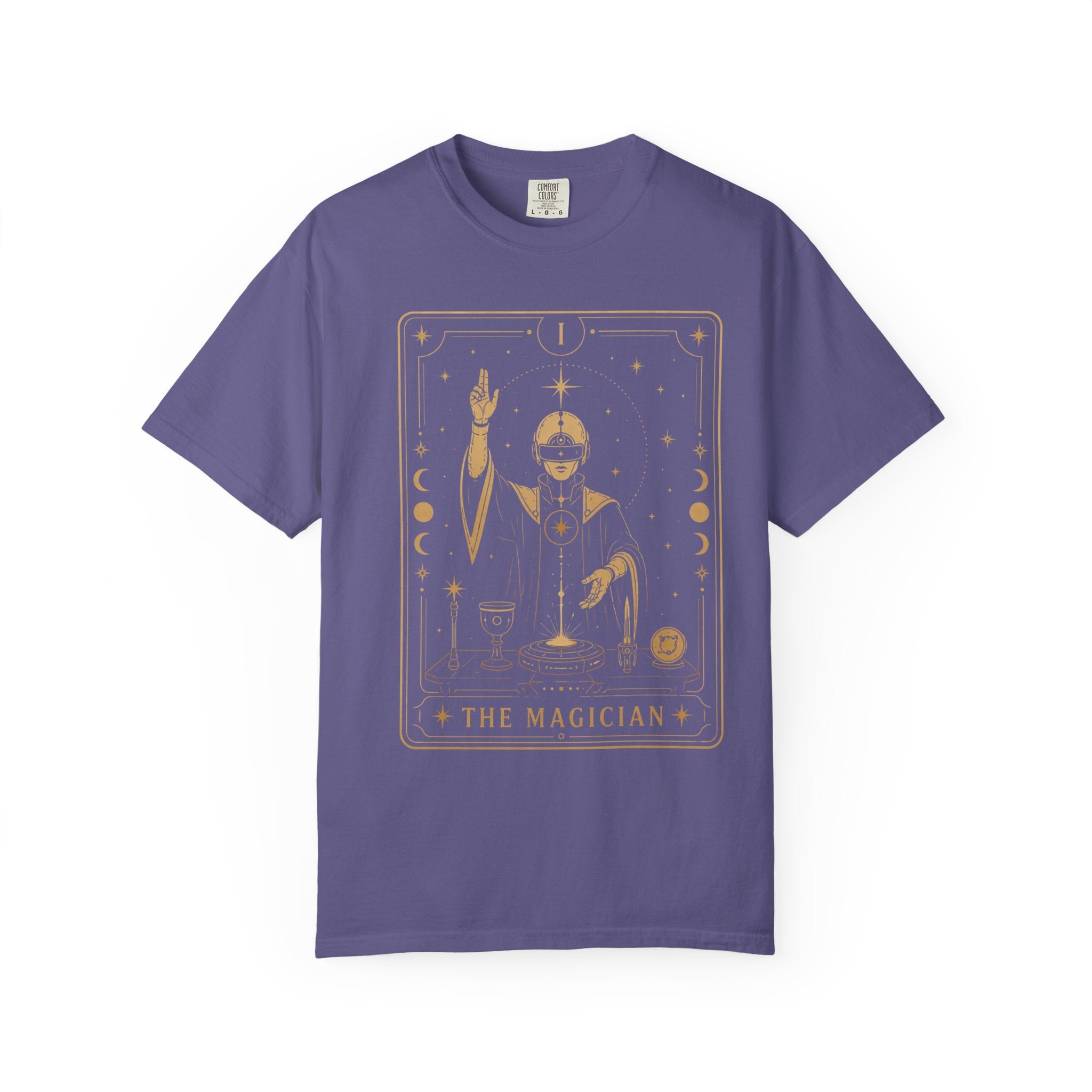 A purple short-sleeve crewneck t-shirt featuring a gold-colored graphic of 'The Magician' tarot card on the front, displayed against a solid white background.