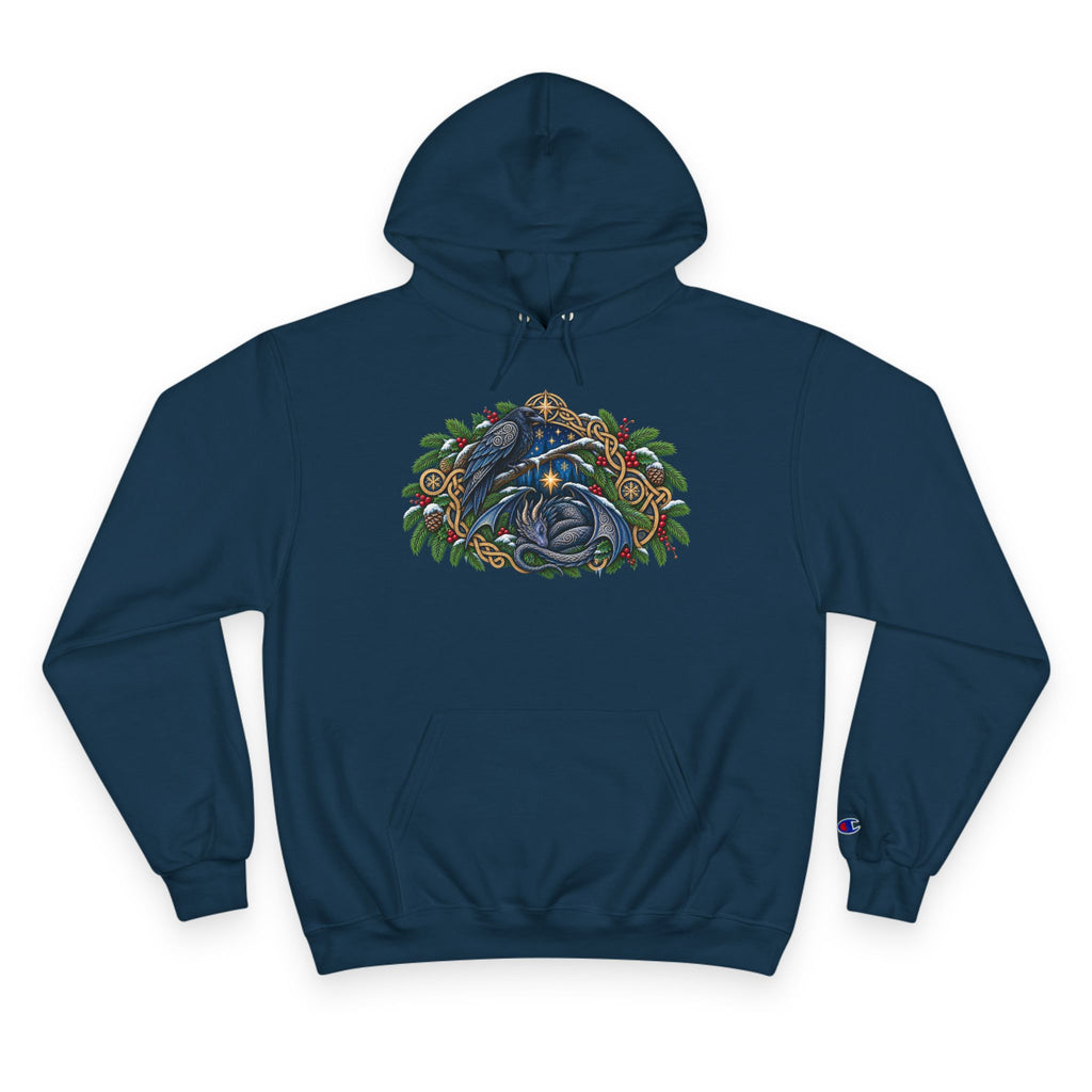 A navy blue pullover hoodie featuring a detailed graphic of a blue raven and a dragon surrounded by green pine boughs  A small blue Champion 'C' logo is visible on the left sleeve cuff. against a white background