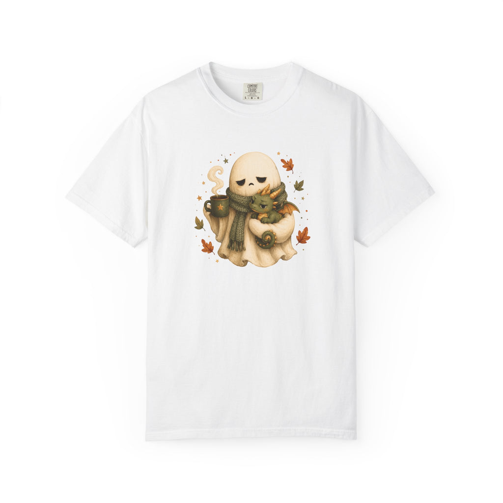 A white short-sleeve crewneck t-shirt featuring a central graphic of a cute cartoon ghost wearing a green scarf and holding a small dragon
amidst autumn leaves.