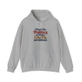 A gray hoodie that features a colorful graphic on the chest with the words 'I dont Do Politics at Dinner I do Pie and Silence in a rainbow of stylized fonts against a white background