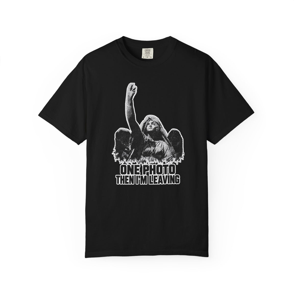 A black short-sleeve crewneck t-shirt with a white graphic print of an angel with raised arm and the text 'ONE PHOTO THEN I'M LEAVING' on the front, displayed against a solid white background.