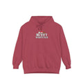 A dusty rose pink pullover hoodie with a front kangaroo pocket and drawstring hood, featuring a 'MERRY WHATEVER' graphic with a small Santa Claus illustration on the chest, displayed against a solid white background.