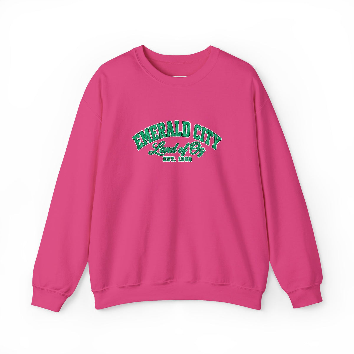 A bright pink pullover crewneck sweatshirt with 'EMERALD CITY Land of Oz EST. 1900' printed in green varsity-style lettering on the chest, displayed against a clean white background.