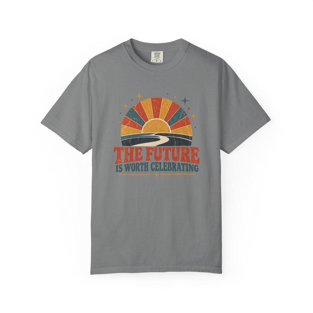 A gray short-sleeve t-shirt with a retro sunset graphic and the text 'THE FUTURE IS WORTH CELEBRATING' printed on the chest, displayed against a plain white background.