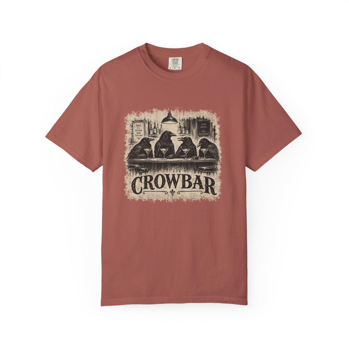 A dusty rose short-sleeve crewneck t-shirt featuring a vintage-style graphic print of four crows sitting at a bar with the text 'CROWBAR' underneath, displayed on a clean white background.
