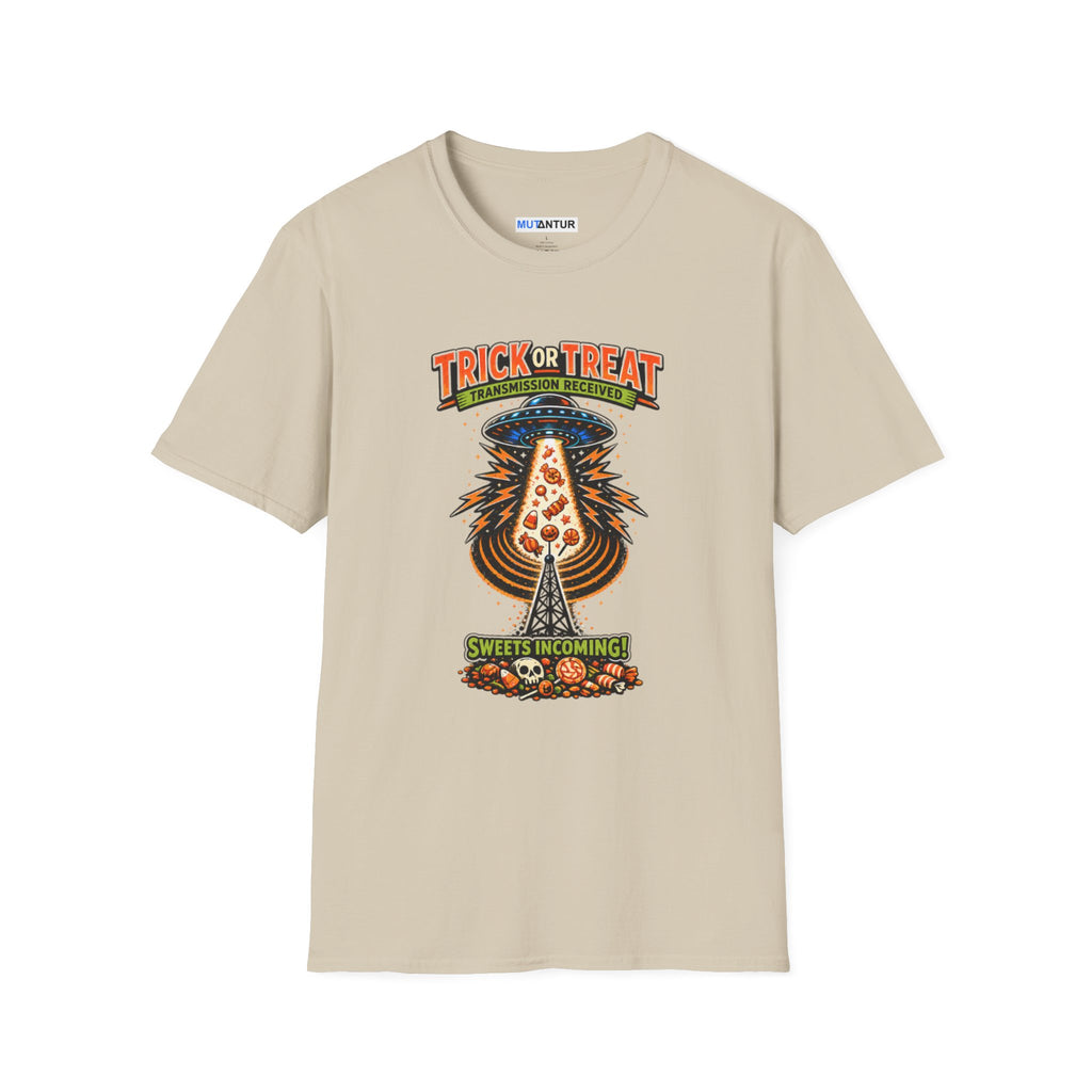 A beige  short-sleeve crewneck t-shirt featuring a colorful graphic print on the front. The graphic shows a UFO Beaming up candy flying upward from a haunted house under the text 'TRICK OR TREAT' and 'SWEETS COMING !', with a small 'MUTANTUR brand label visible inside the collar.