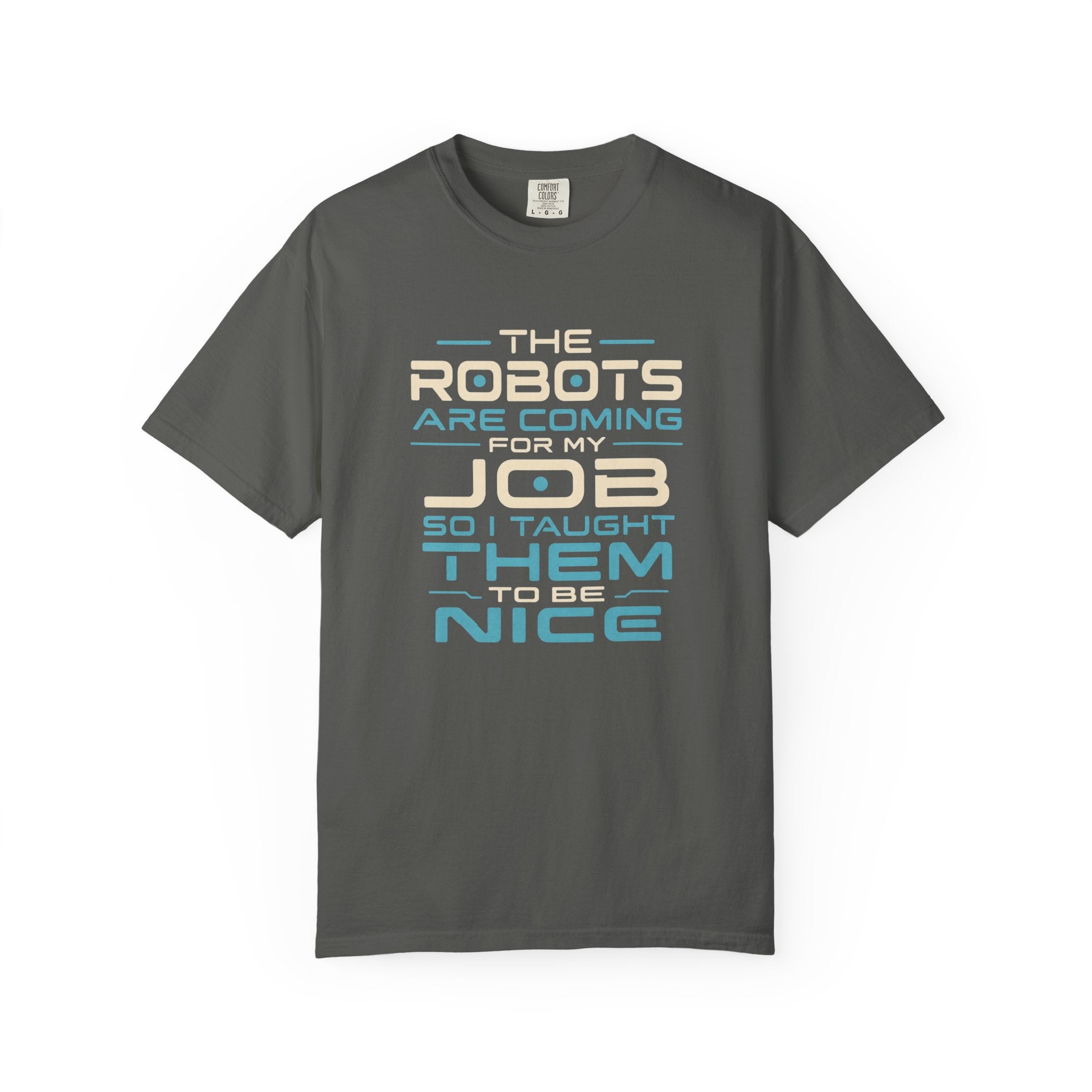 A dark gray short-sleeve t-shirt with a humorous text graphic on the front that reads 'THE ROBOTS ARE COMING FOR MY JOB SO I TAUGHT THEM TO BE NICE' in cream and light blue lettering, displayed on a clean white background.