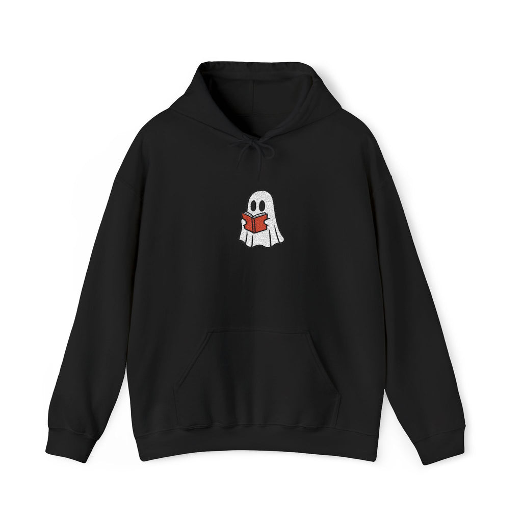 A black hoodie with a cartoon ghost holding a red book against a white background