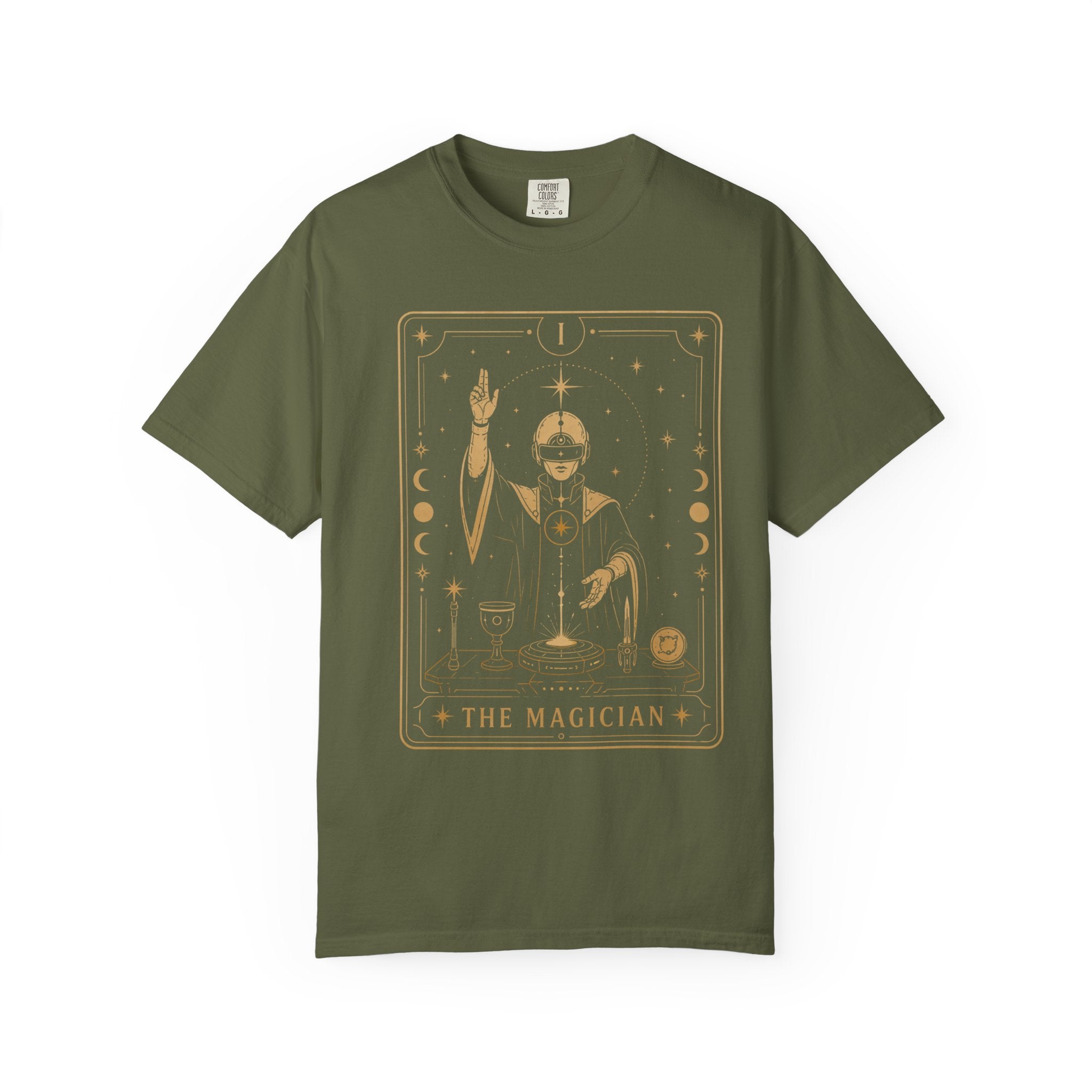An olive green Comfort Colors t-shirt featuring The Magician from the Future Arcana collection, inspired by The Magician tarot card. A futuristic cosmic mystic channels radiant energy above a celestial altar within an elegant Art Deco frame rendered in vintage gold line art on a transparent background.