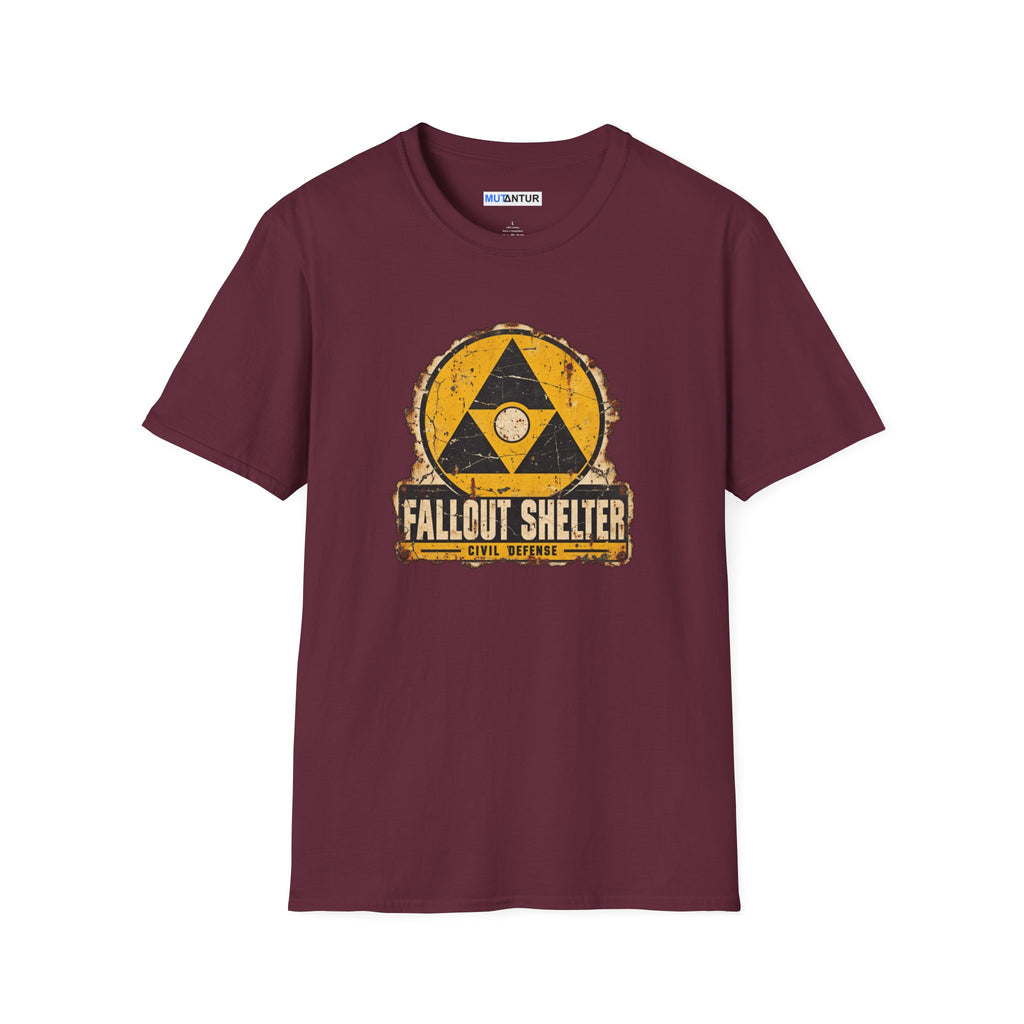 A maroon  crew neck shirt with a vintage graphic depicting a  yellow and black  Fallout Shelter  sign design with the words Civil Defense at the bottom against a white background