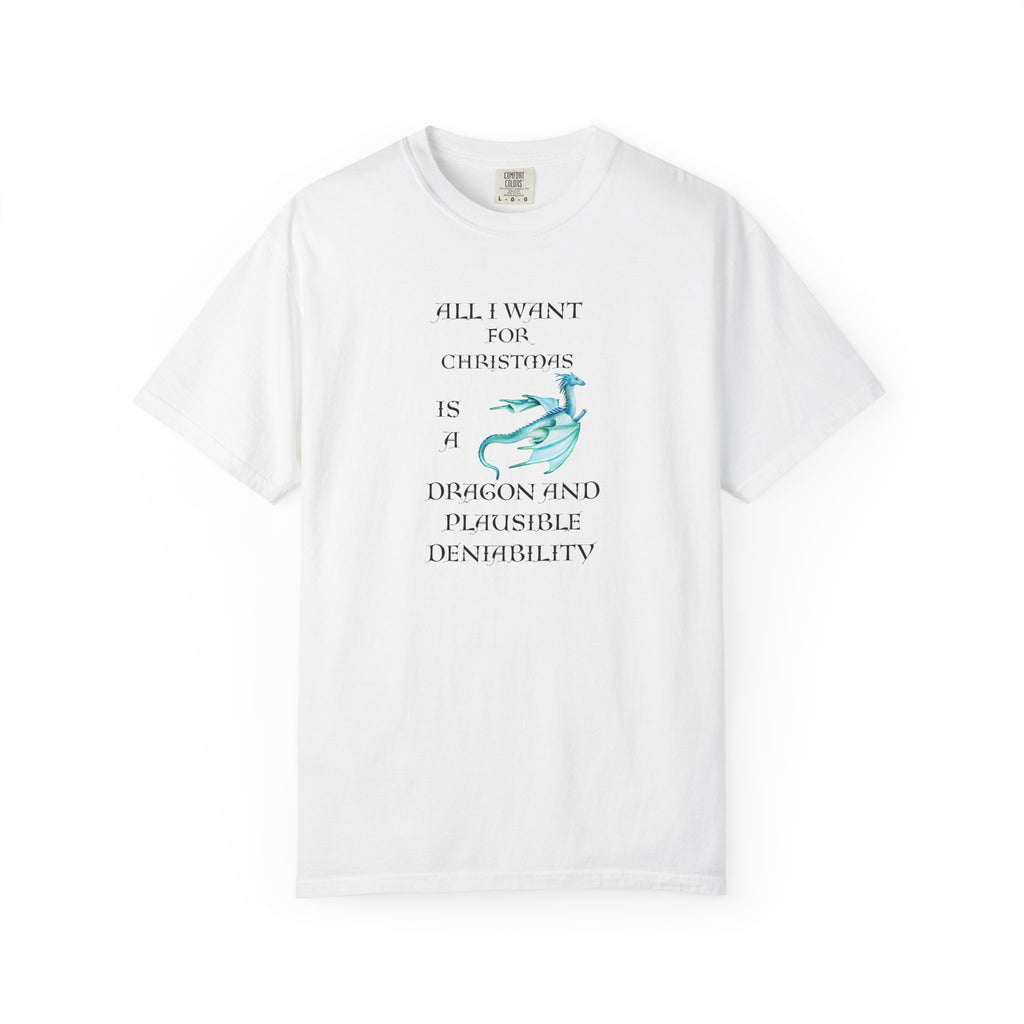 A white short-sleeve crewneck t-shirt featuring a graphic print on the front with the text 'ALL I WANT FOR CHRISTMAS IS A DRAGON AND PLAUSIBLE DENIALABILITY' in black, accompanied by a light blue dragon illustration.