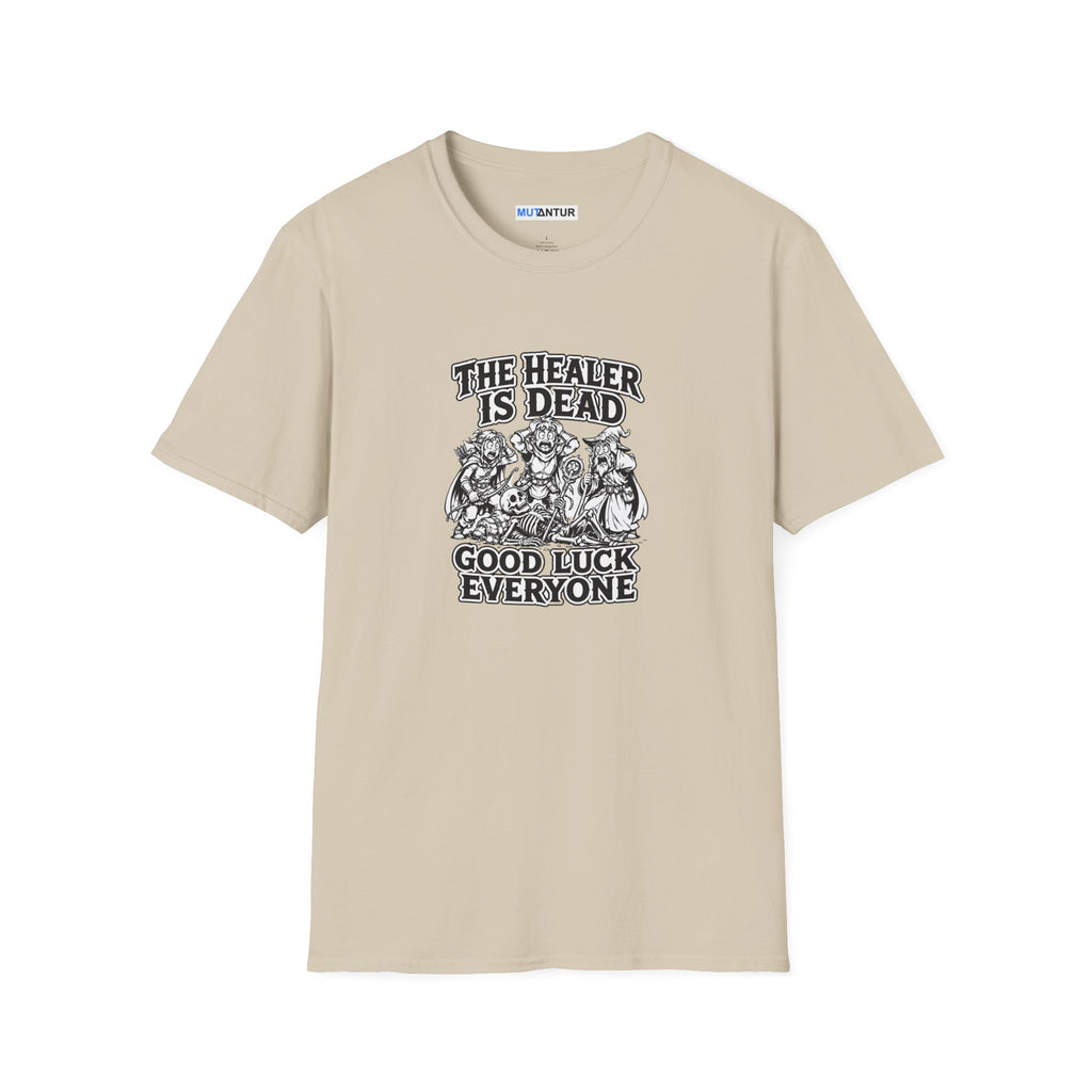 A beige  short-sleeve crewneck t-shirt with a black graphic print on the front. The graphic features the text 'THE HEALER IS DEAD' and 'GOOD LUCK EVERYONE' surrounding an illustration of three figures.