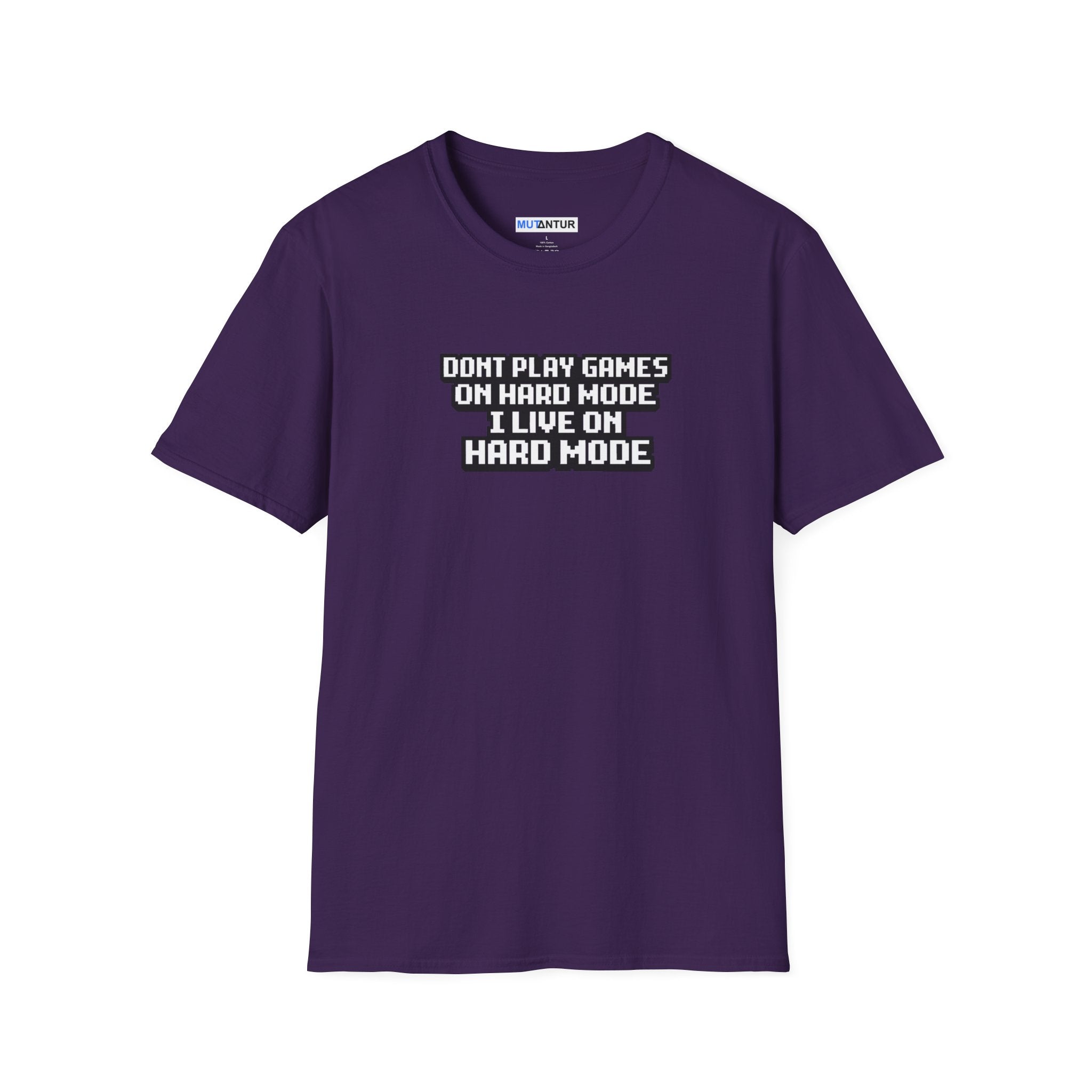 A purple short-sleeve t-shirt with a white and black text graphic on the chest that reads 'DONT PLAY GAMES ON HARD MODE I LIVE ON HARD MODE'. The shirt is displayed flat against a solid white background.
