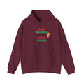 A maroon pullover hoodie with a festive graphic on the chest that reads 'MERRY CHRISTMAS FROM THE UNPAID LIVESTOCK' in red and green lettering, accompanied by a small cartoon reindeer.