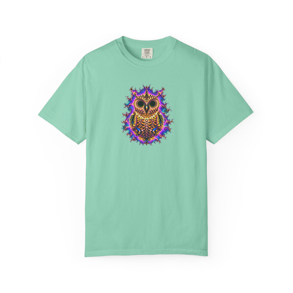 A mint green short-sleeve crewneck t-shirt featuring a colorful, psychedelic owl graphic printed on the center chest, displayed against a solid white background.