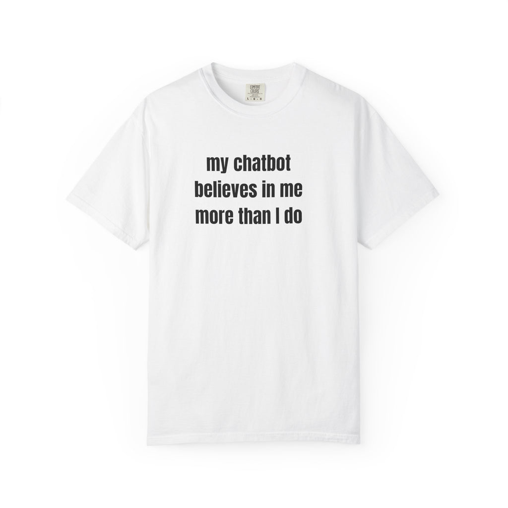 A white short-sleeve crewneck t-shirt with the text 'my chatbot believes in me more than I do' printed in black on the chest, displayed on a clean white background.