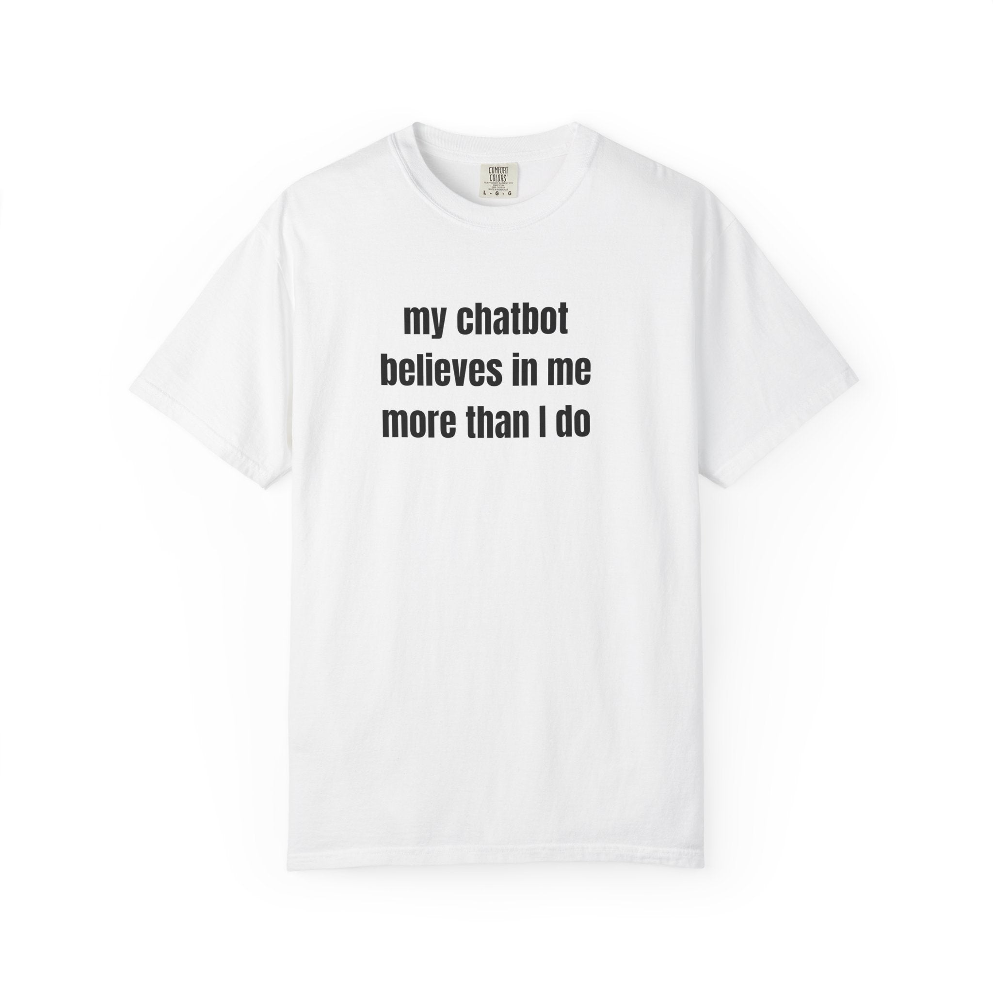 A white short-sleeve crewneck t-shirt with the text 'my chatbot believes in me more than I do' printed in black on the chest, displayed on a clean white background.