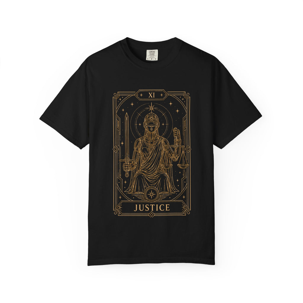 A black crewneck Comfort Colors t-shirt featuring Justice from the Future Arcana collection, inspired by the Justice tarot card. A futuristic blindfolded guardian holds a sword and balanced scales within an elegant Art Deco celestial frame rendered in vintage gold line art on a transparent background.