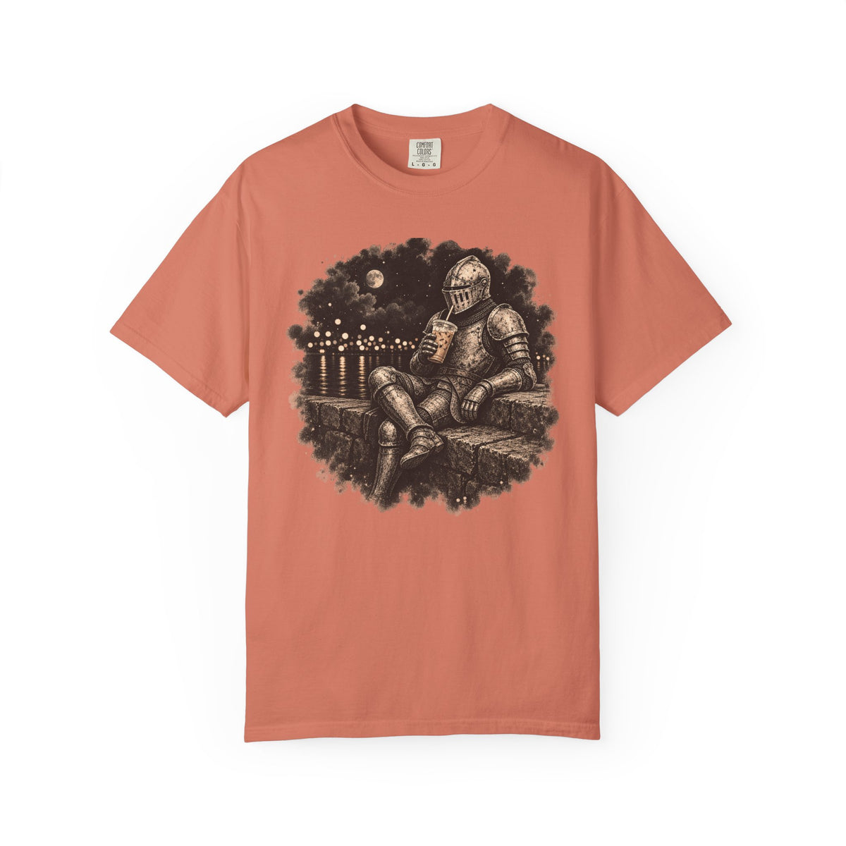 A orange  short-sleeve crewneck t-shirt featuring a circular graphic print of a knight in armor sitting on a stone wall under a full moon, drinklng iced coffee 