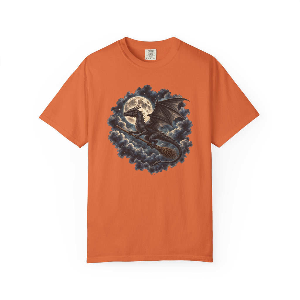 An orange short-sleeve crewneck t-shirt featuring a graphic print of a black dragon flying through dark blue clouds with a full moon in the background, displayed on a clean white background.