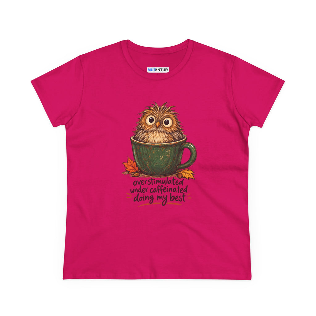 A bright pink short-sleeve t-shirt with a graphic of a cute owl sitting in a green mug, surrounded by autumn leaves and the text 'overstimulated under caffeinated doing my best'.