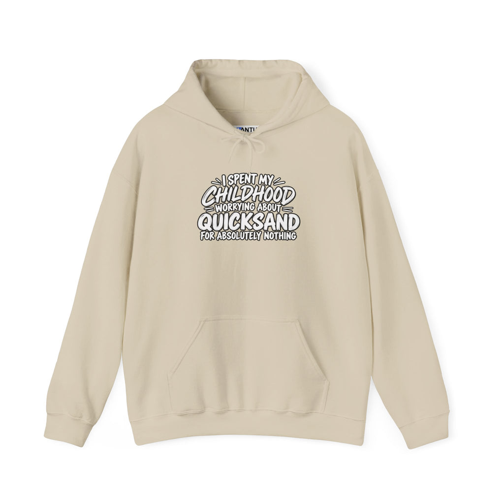 A tan hoodie with white text that reads: I SPENT MY CHILDHOOD WORRYING ABOUT QUICKSAND FOR ABSOLUTELY NOTHING' against a white background